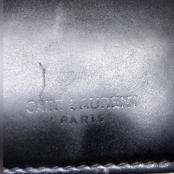Beautiful wallet only damaged in the coin pocket can see the rest